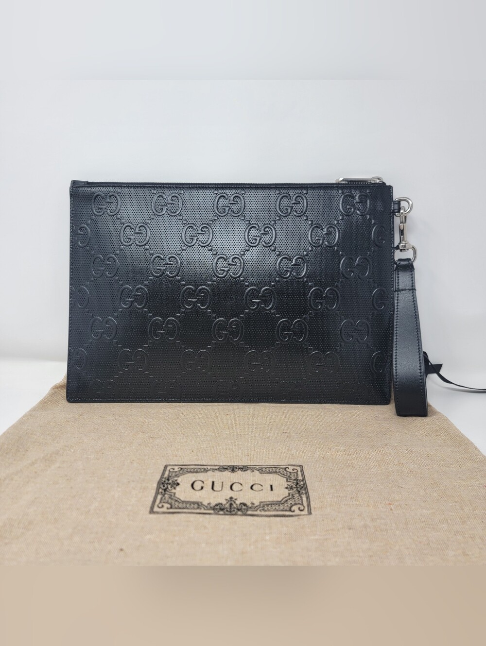 GUCCI GG Embossed Perforated Leather Wristlet Clutch - Picture 2 of 8